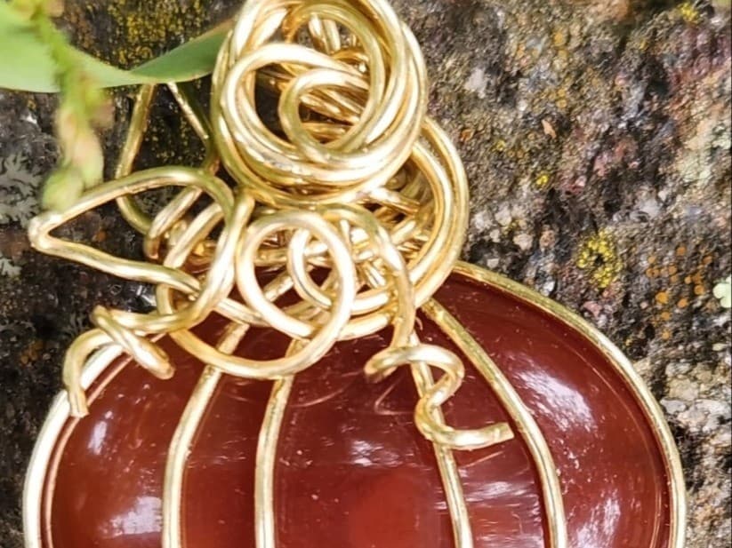Wire wrapping a pumpkin pendant